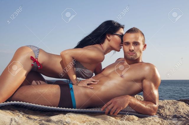 26444319-Couple-lies-on-beach-Girl-kissing-guy-Sto Picture Box