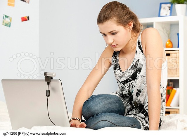 teenage-girl-using-laptop-with-webcam Picture Box