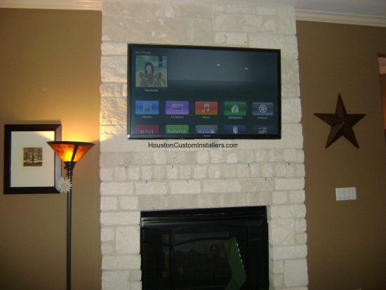 TV on Brick Fireplace Installation Houston Custom Installers