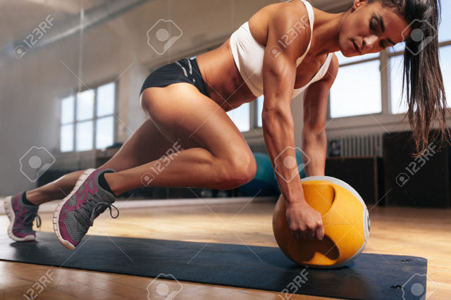 43852716-Muscular-woman-doing-intense-core-workout Picture Box