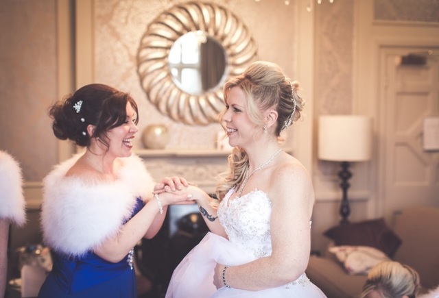 Bride Laughing with Maid of Honour Photography Service in Basildon