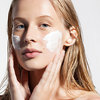 Blond-woman-applying-cream-... - http://www.wecareskincare