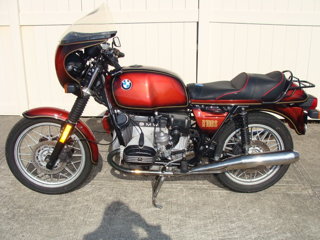 6240140 '81 R100S Red Smoke.02 1981 BMW R100S #6240140, Smoke Red. 60,090 Miles. Koni Shocks; Progressive Fork Springs w/ Anti Dive Kit; 336 Sport Cam; Stainless Mufflers; Sargent Sport Seat; Reynolds Ride-Off Stand; Brown Side Stand; Napoleon Baren Mirrors; Euro Headlight switch; New 