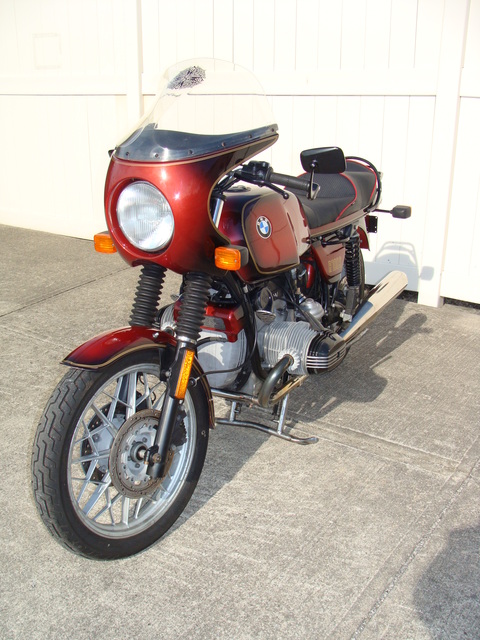 6240140 '81 R100S Red Smoke.15 1981 BMW R100S #6240140, Smoke Red. 60,090 Miles. Koni Shocks; Progressive Fork Springs w/ Anti Dive Kit; 336 Sport Cam; Stainless Mufflers; Sargent Sport Seat; Reynolds Ride-Off Stand; Brown Side Stand; Napoleon Baren Mirrors; Euro Headlight switch; New 