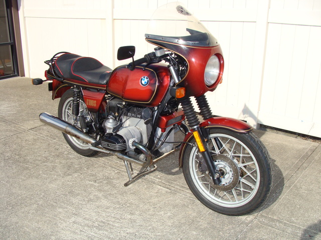 6240140 '81 R100S Red Smoke.18 1981 BMW R100S #6240140, Smoke Red. 60,090 Miles. Koni Shocks; Progressive Fork Springs w/ Anti Dive Kit; 336 Sport Cam; Stainless Mufflers; Sargent Sport Seat; Reynolds Ride-Off Stand; Brown Side Stand; Napoleon Baren Mirrors; Euro Headlight switch; New 
