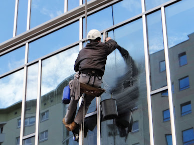 Washing windows at the Ambassador Office Building  Window Tinting Parkland