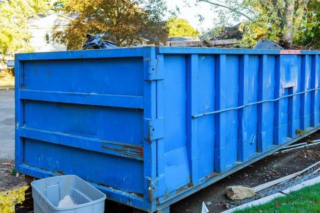blue-dumpster-in-yard 1 orig-min Same Day Dumpster Rental Manhattan