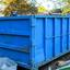 blue-dumpster-in-yard 1 ori... - Same Day Dumpster Rental Lake Charles