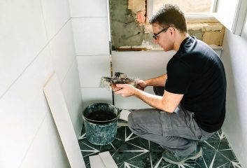 mason-working-on-a-bathroom-renovation-qbnvjv4mi8n Trinity Construction & Painting Inc.