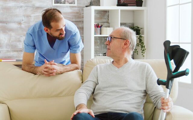 elderly-man-having-conversation-with-male-nurse-co Prairie Hill Home Care