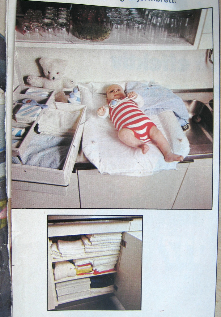 changing-baby-in-kitchen - 